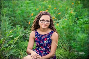 high school senior portraits field of flowers