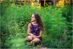 high school senior portraits field of flowers