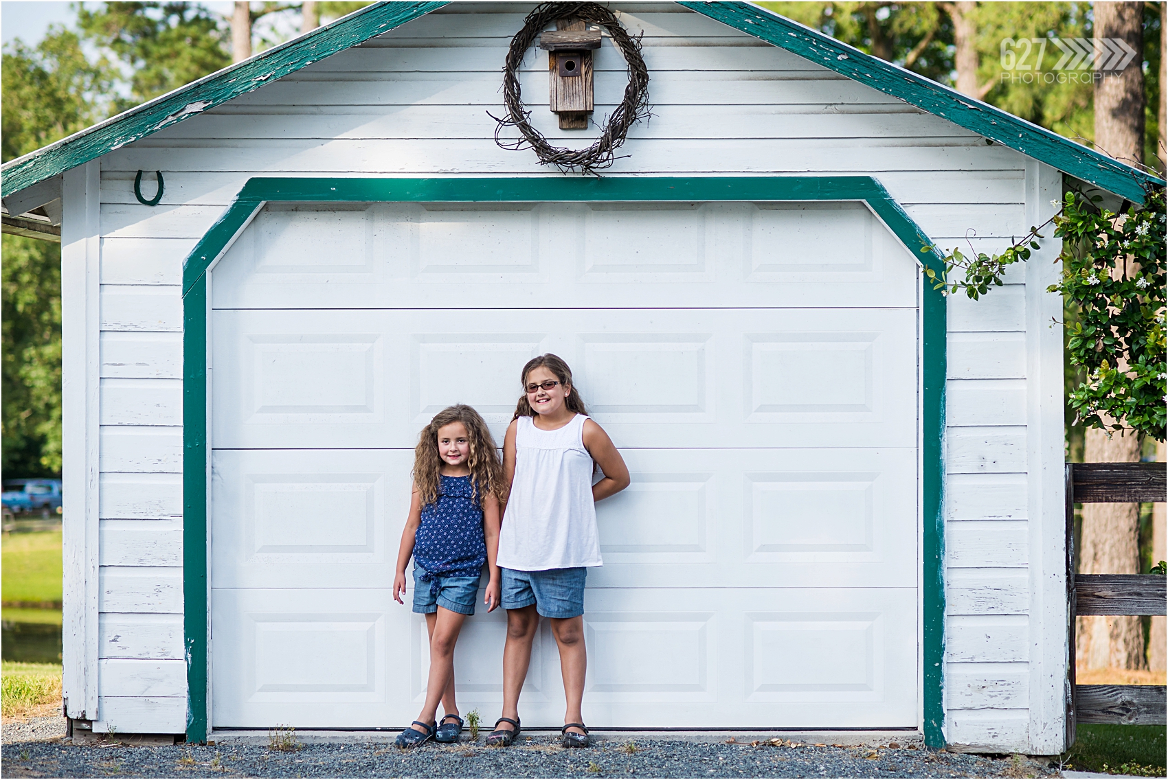 2 sisters in front of garage
