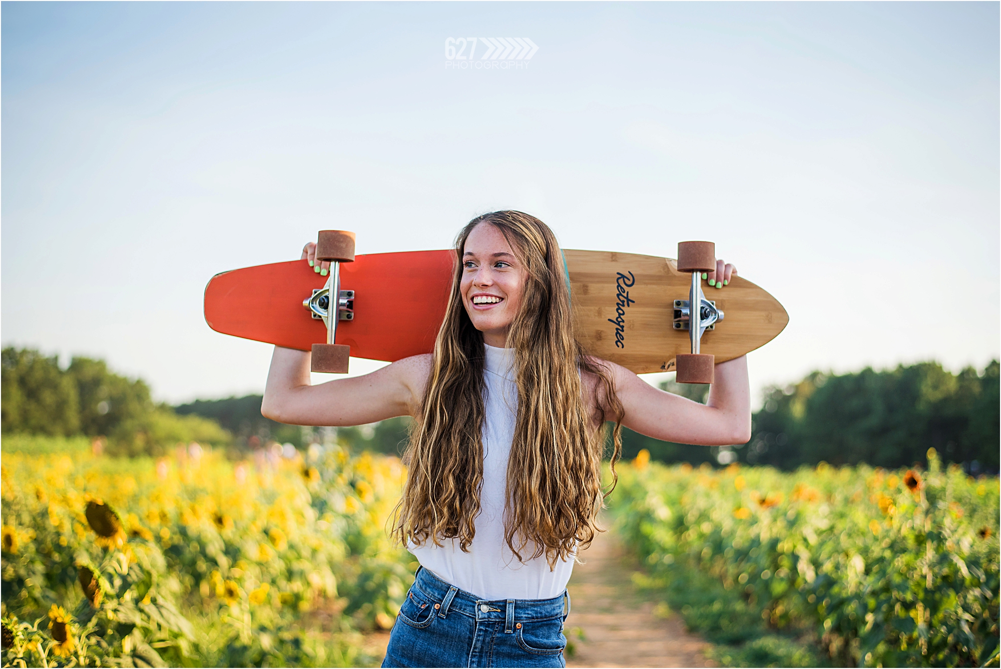 senior girl with long board