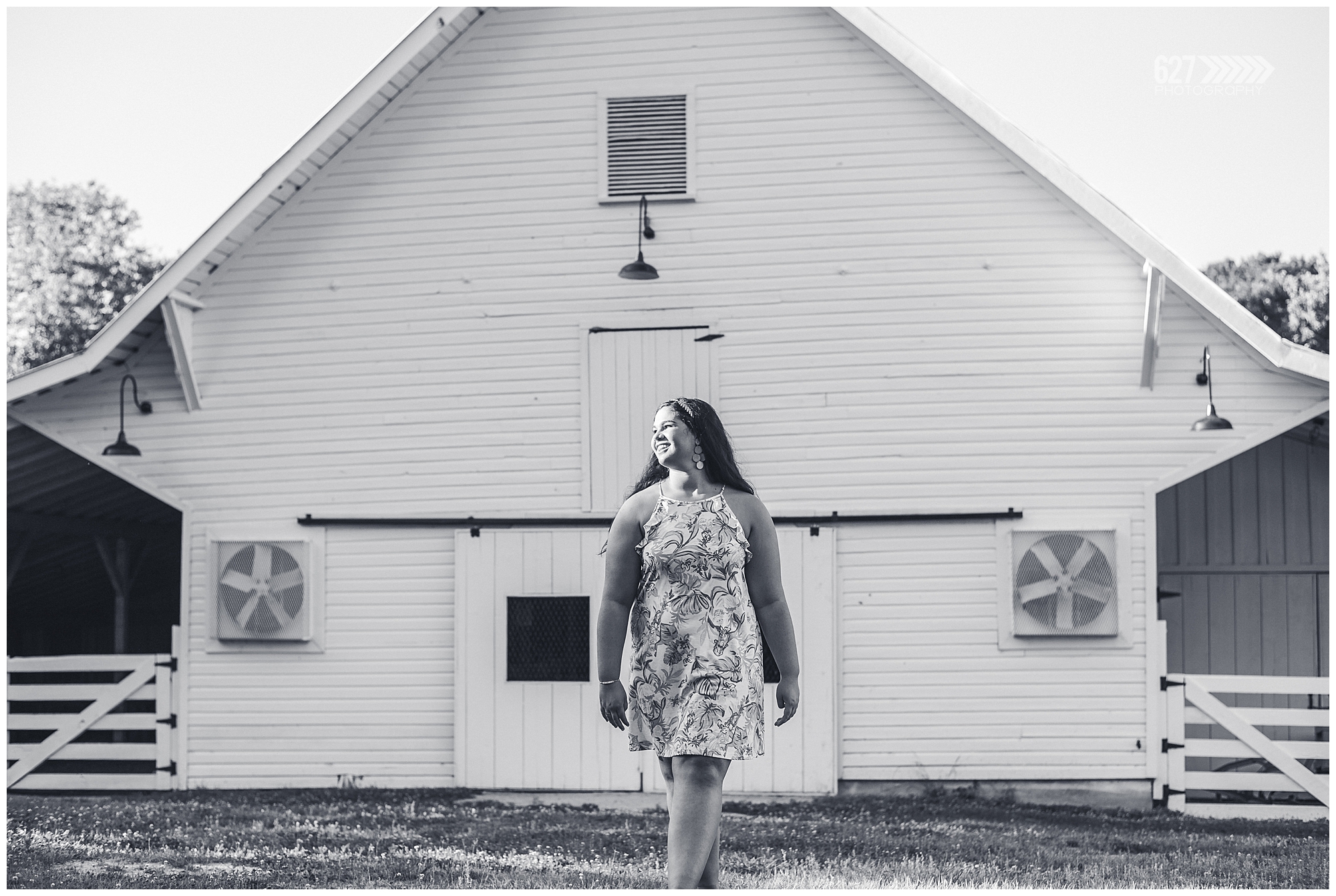 senior girl in front of barn