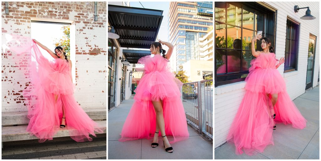 senior girl wearing big pink tulle dress downtown