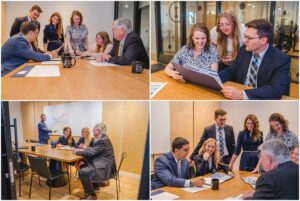 Financial planning team collaborating around a conference table during a professional branding photo session.