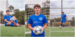 Natural senior photos of high school guy walking on soccer field in Apex North Carolina
