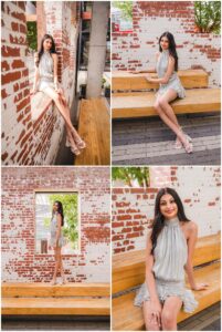 Senior girl posing in downtown Raleigh with brick architecture and natural light