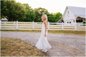 Senior pictures at Oak View Historic Farm with rustic barn backdrop in Raleigh NC