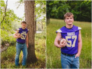 High school football player holding a football during senior pictures in Holly Springs